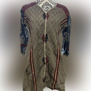 Handmade tunic. Embellished with mirrors and jute trimmings.